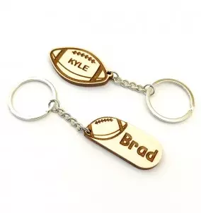 Personalized American Football keychain with an engraved name of your choice. The picture shows both designs available.