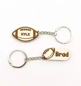 Personalized Rugby keychain with an engraved name of your choice. The picture shows both designs available.