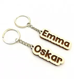 Personalized Keychain With Custom Name Engraving. Comic-style name engraving on keyring.
