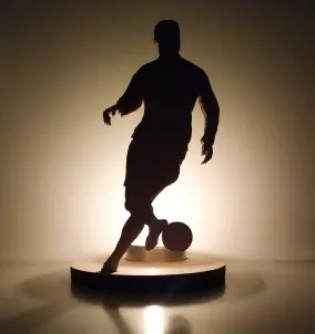 Unique Wooden Candle Holder / Stand football Player Dribbling - with lighted candle