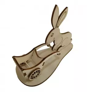 Easter bunny with a wheelbarrow for easter eggs - side view