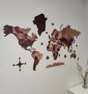 3D Wooden World Map - map installed on a wall in a bedroom.