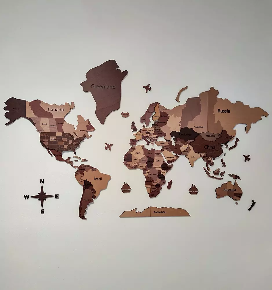 Wooden World Map mounted on a wall in a bedroom, highlighting how the map can complement and add to any room's decor style.