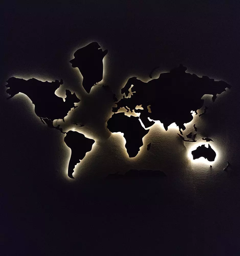 A view of our wooden world map with LED backlights, showcasing the stunning display in the dark