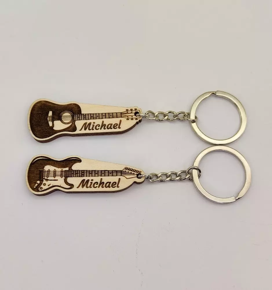 A photo of the personalized acoustic and electric guitar keychains, showcasing the intricate design and custom name engraving.