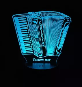 Personalisierte 3D-LED-Lampe in Form eines Piano-Akkordeons, das in blauer Farbe leuchtet.
