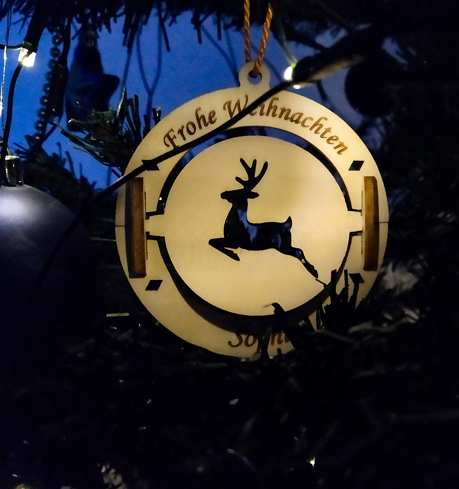 Reindeer Christmas Ornament With Custom Text On A Christmas Tree.